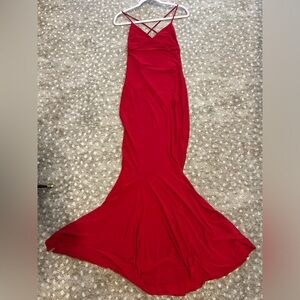 Beautiful long fishtail bottom dress with spaghetti straps. Low back detail